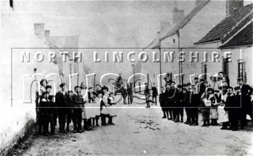 Group of children in Butterwick Road, Messingham, in a view looking west from the junction with the High Street, c.1905. 	