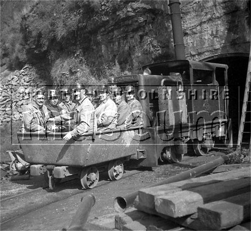 Santon Mining Company record photograph showing the visit of the mines committee of the Lincolnshire Ironmasters Association about to enter Winn's Ironstone Mine, 1 September 1943 	