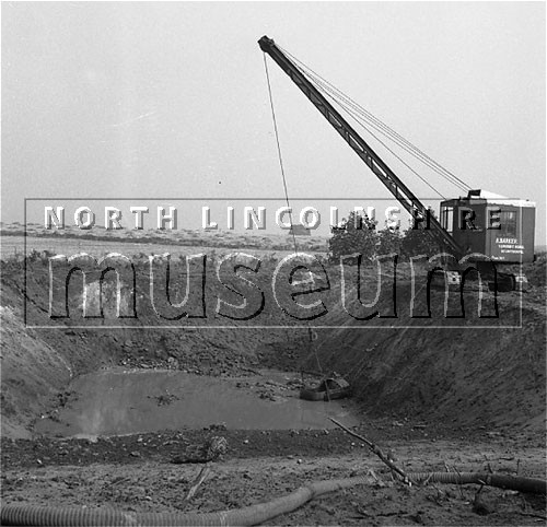 Santon Mining Company record photograph, water seeping into the portal excavation for the North Adit from the Pecten Bed, 22 September 1955 	