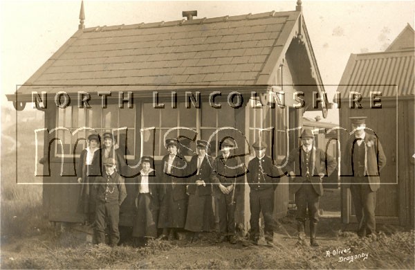 Shunters and lady number takers outside their cabin at Normanby Park goods station, also known as Dragonby sidings c.1920 	