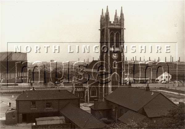 St. John's Parish church, Scunthorpe, c.early 1980's, taken looking east from the multi-storey car park, and also showing part of the stable range of the former Furnace Arms public house, and the Ashdown Memorial Hall 	