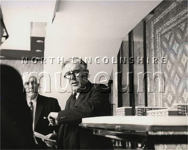 The Rt. Hon. Richard Crossman M.P., the then Minister for Housing and Local Government, examining a model of the Crosby Flats re-dvelopment at Scunthorpe Civic Centre in March 1966 	