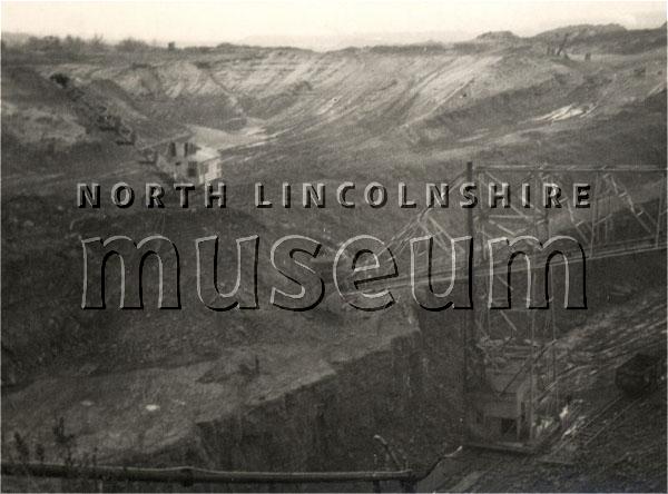 Excavator and conveyor belt at the Richard Thomas and Baldwin's ironstone mine, outside Scunthorpe, on 22 October 1956 	