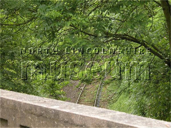 Record photograph of the still active single track branch line from Dragonby sidings on the North Lindsey Light Railway to Flixborough Wharf, taken from the bridge on the Scunthorpe to Burton-upon-Stather road on 15 June 2006 	