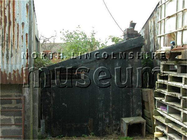 Record photograph of a platelayer's hut on the site of the former Winteringham Station on the North Lindsey Light Railway, now a farm, on 15 June 2006 	