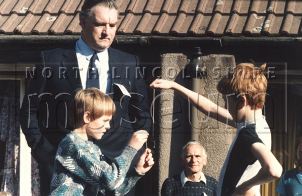 Match taking place during the 1987 European Conker Championships at Grange Farm Hobbies Centre, Scunthorpe on 3 October 1987