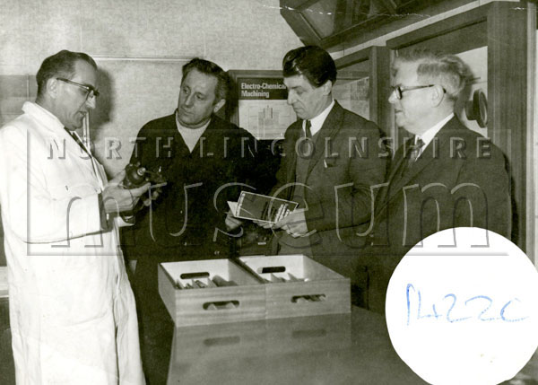 Bernard Copley, on the far right, examining components from Cotto Ltd., Digby Street, Scunthorpe, c.1950's.