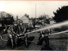 Auxiliary Fire Service demonstration at Winterton during the Second World War in 1941 	